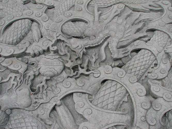 Stone carving in the local park. Chengdu, China.